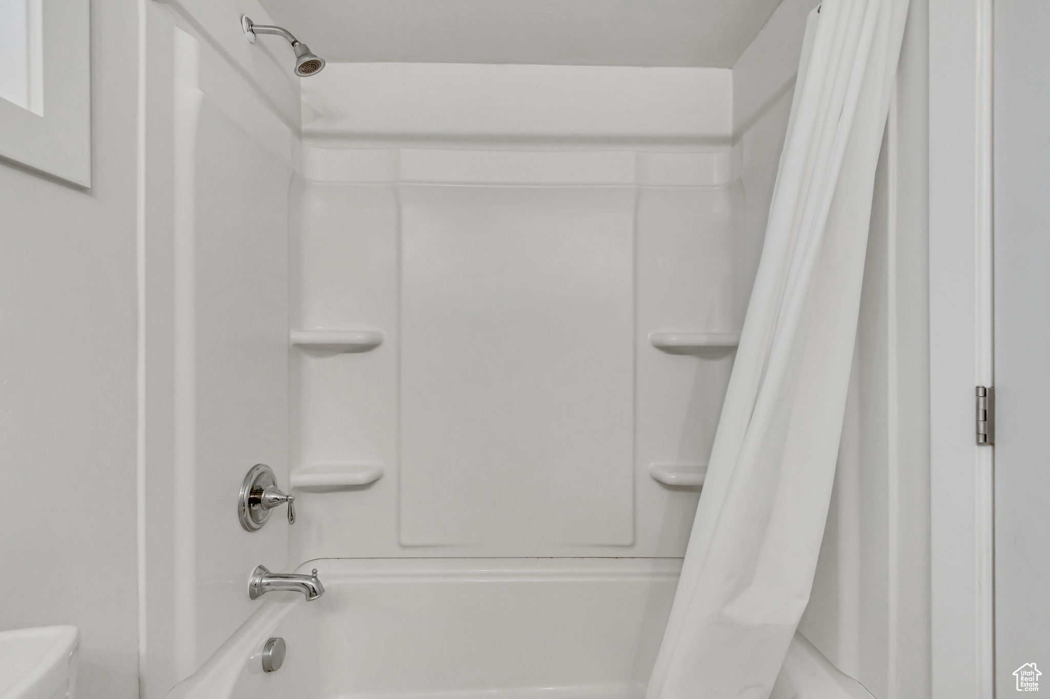 Bathroom featuring shower / bath combo with shower curtain