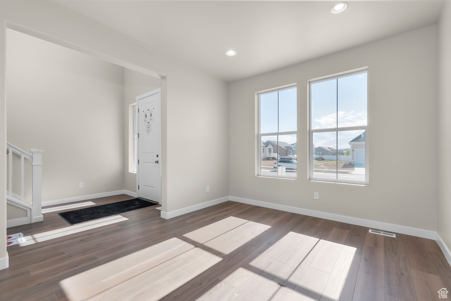 Foyer entrance featuring dark hardwood / wood-style flooring