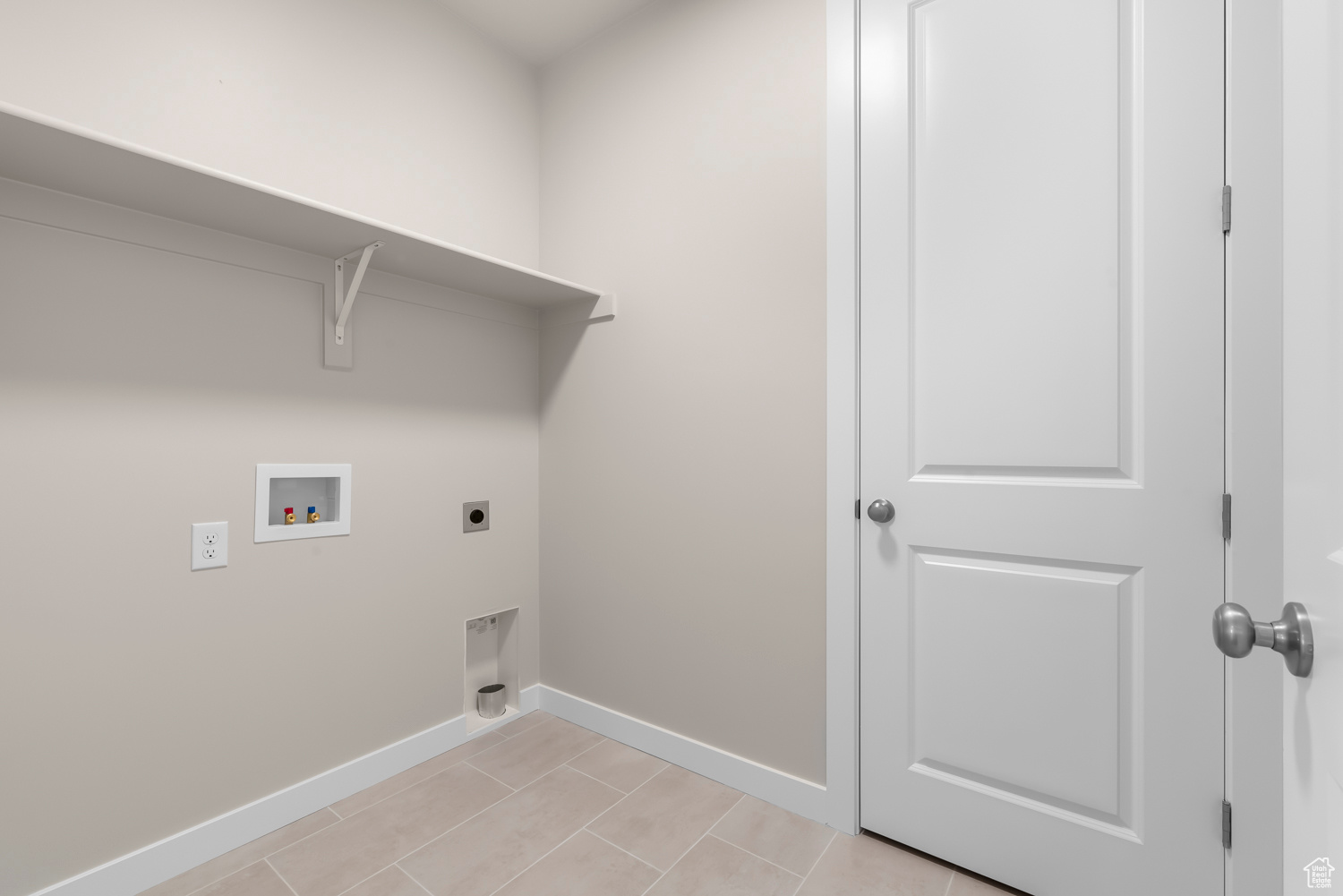 Laundry room with hookup for an electric dryer and hookup for a washing machine