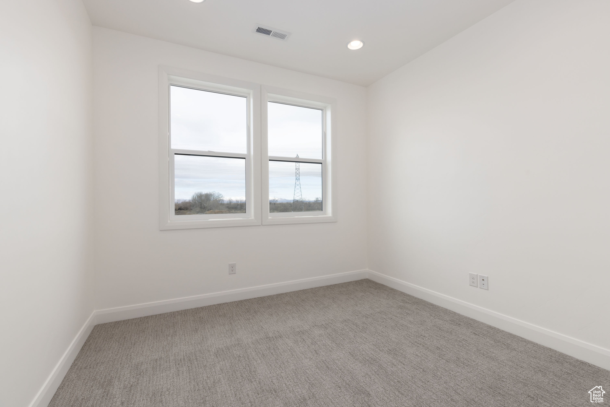 View of carpeted spare room