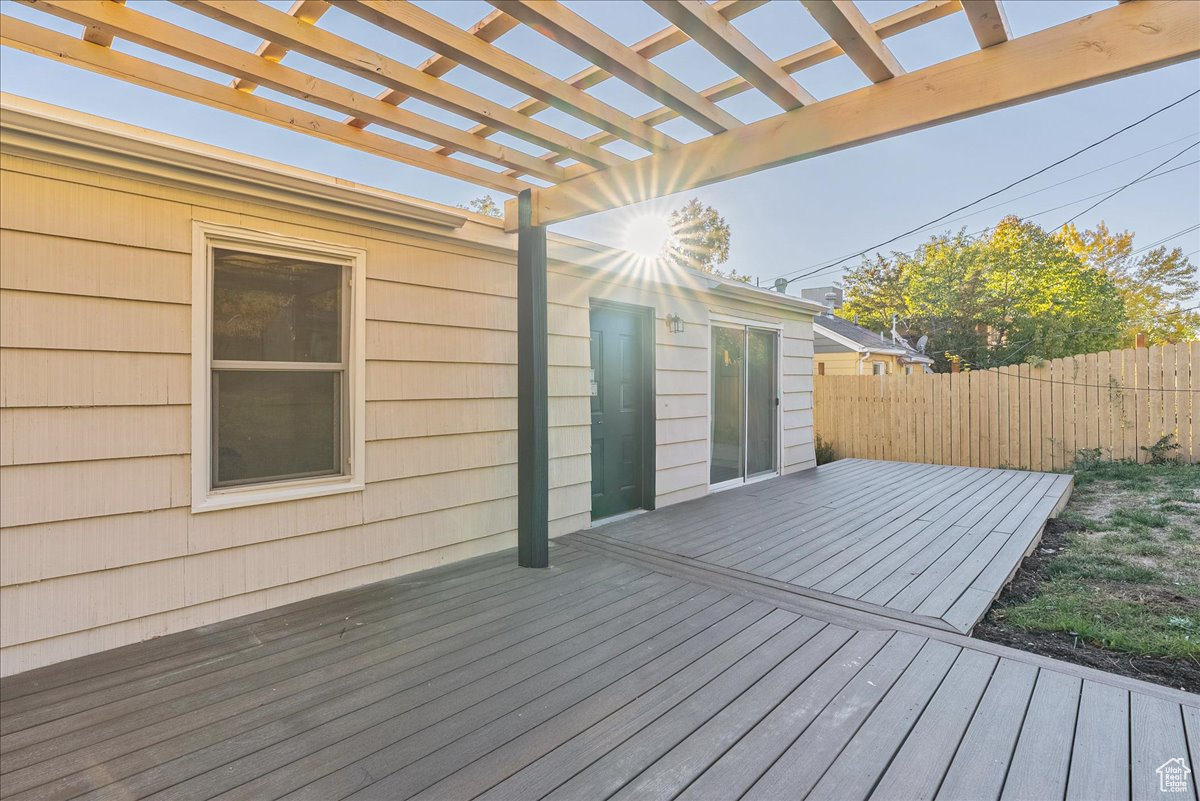 Wooden deck featuring a pergola