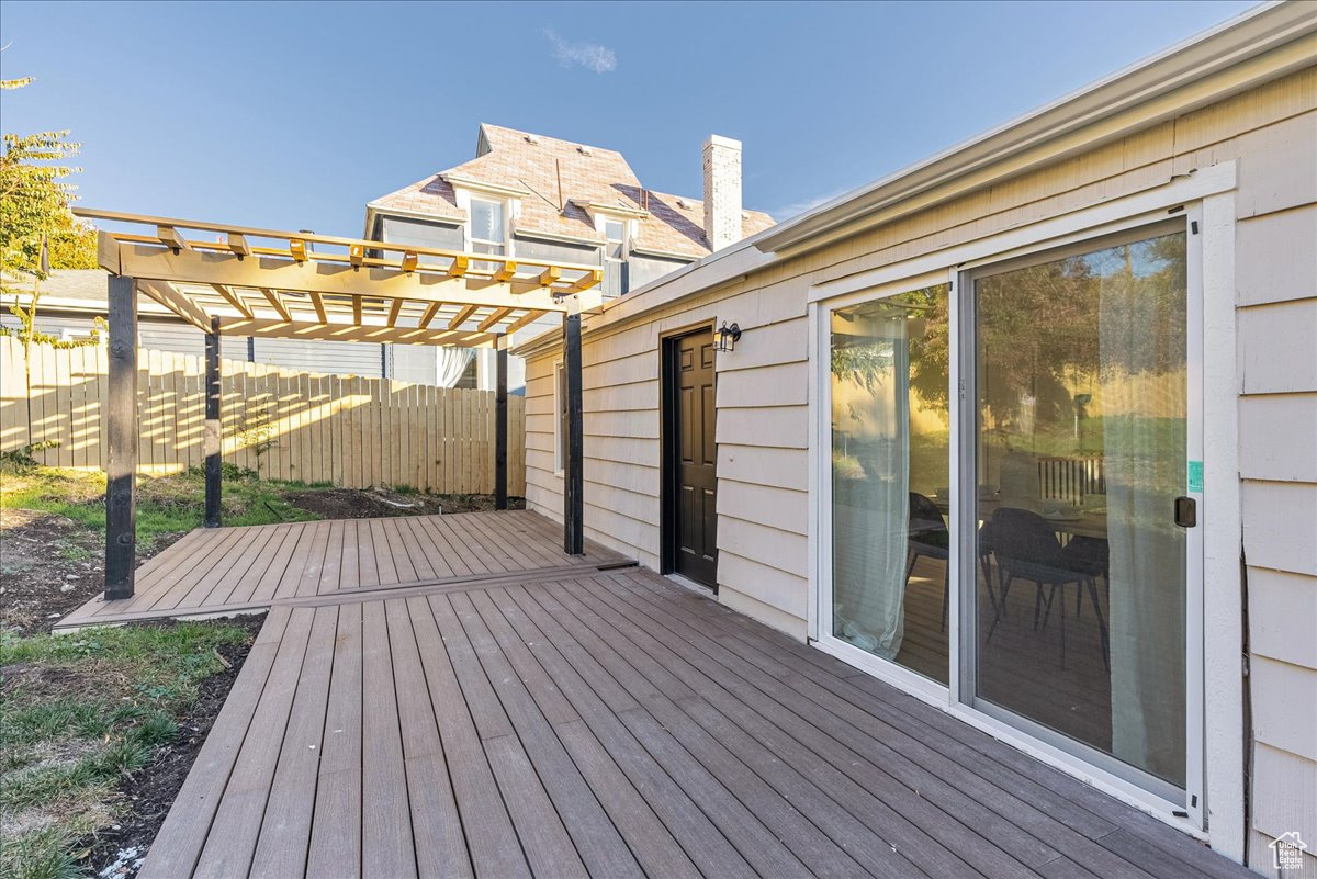 Wooden terrace featuring a pergola