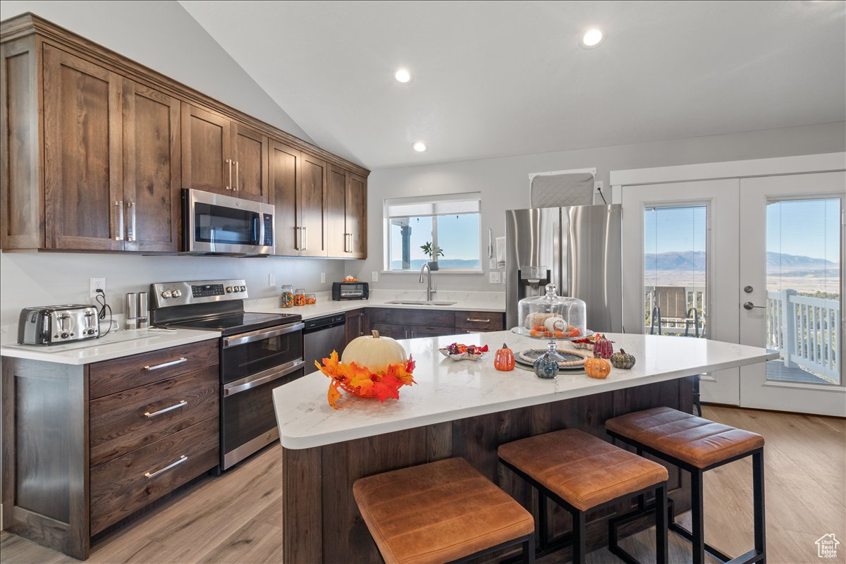 Kitchen with double doors that lead out to main covered patio