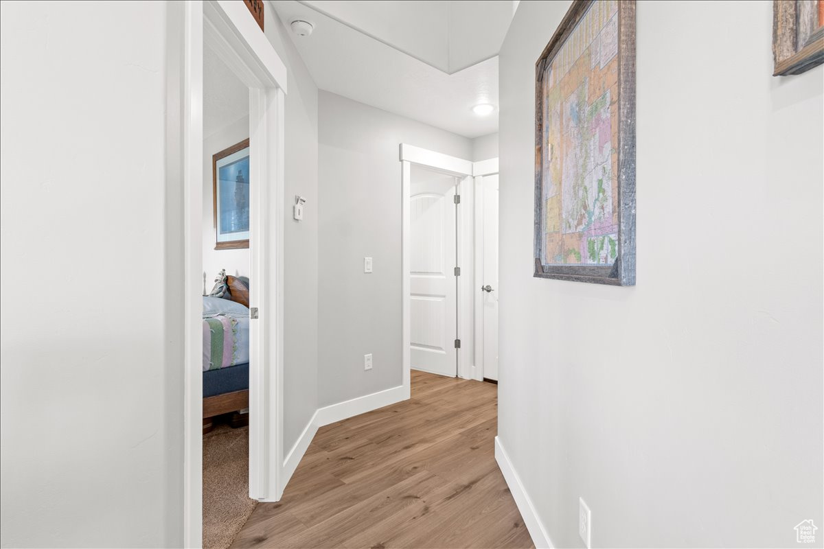 Hallway from kitchen with luxury vinyl