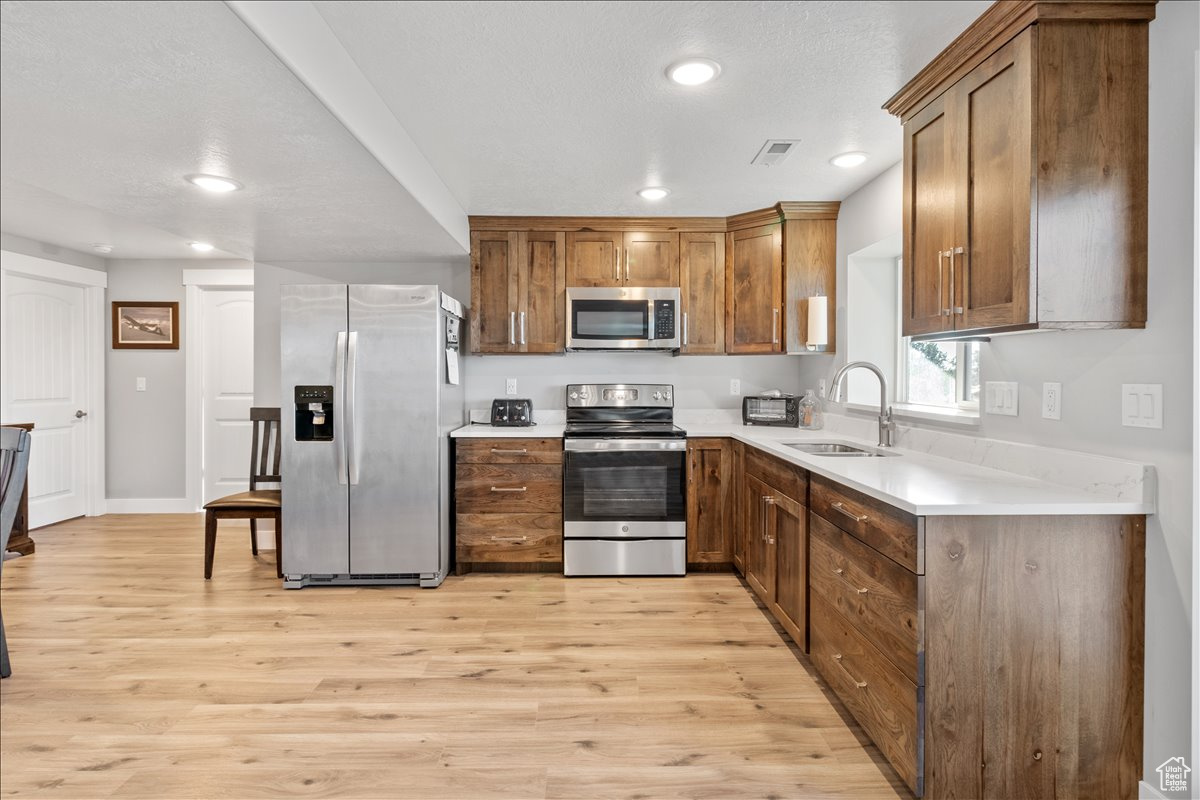 Full downstairs kitchen featuring luxury vinyl quartz countertop high-end cabinetry