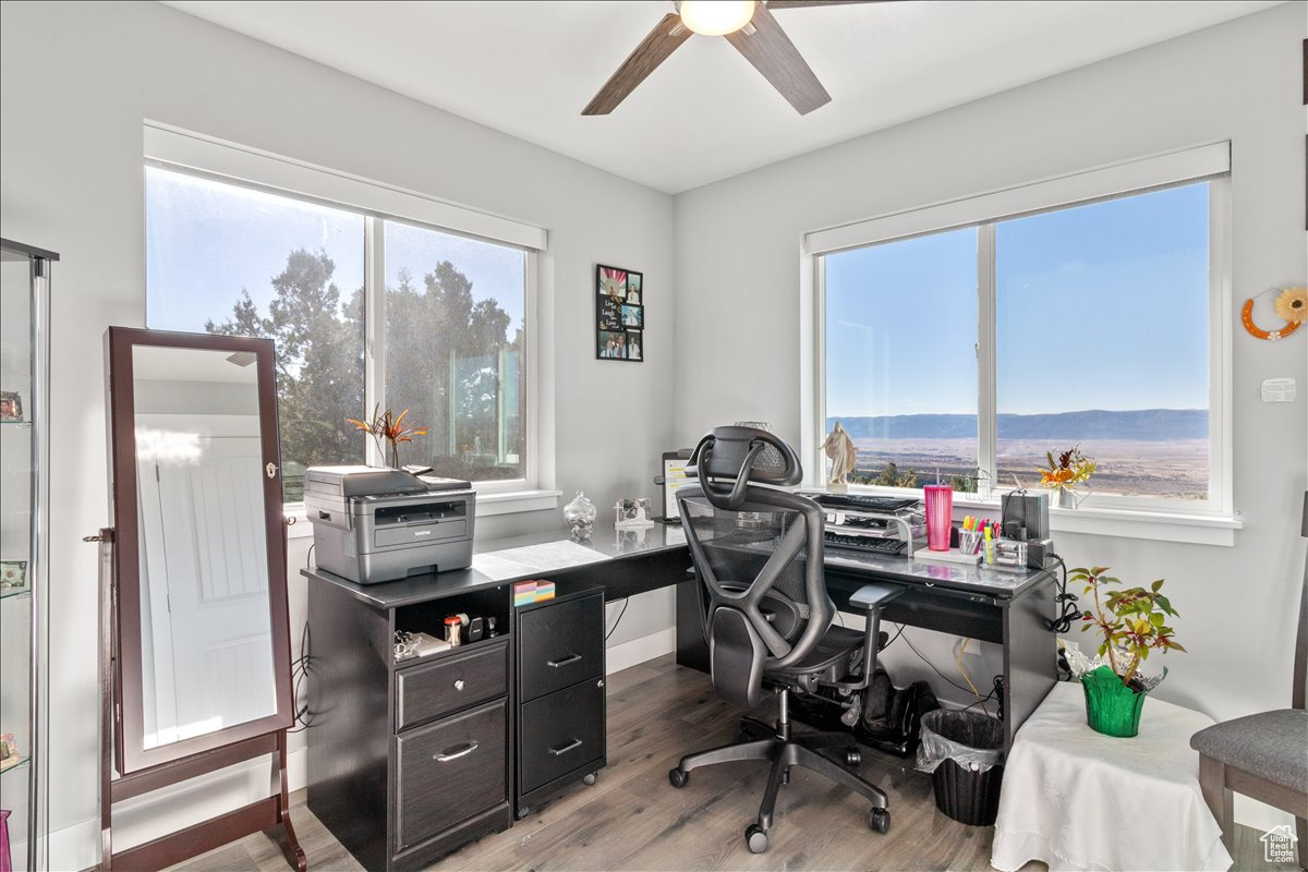 Main floor office featuring luxury vinyl flooring and incredable mountain views