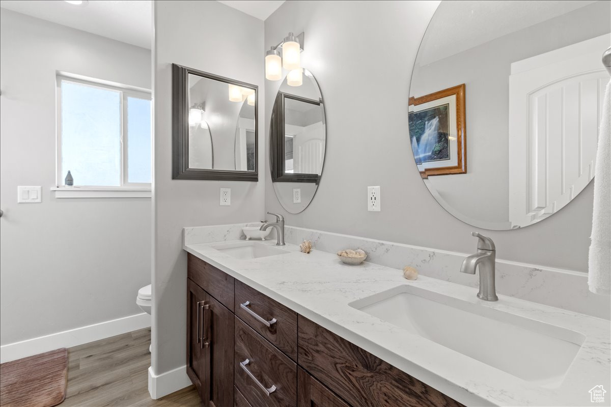 Master bathroom featuring double sinks and quartz countertop