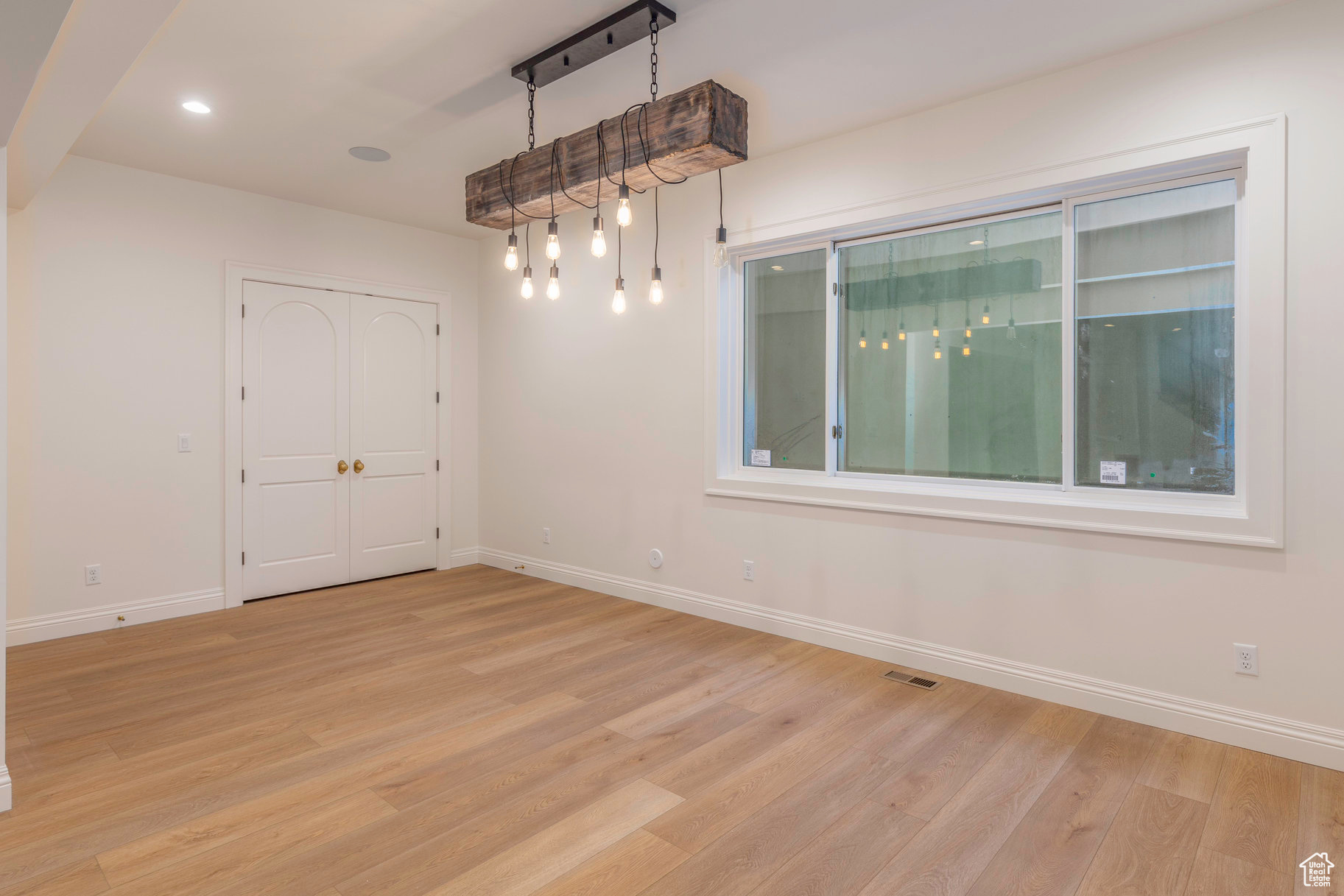 Spare room featuring light hardwood / wood-style floors