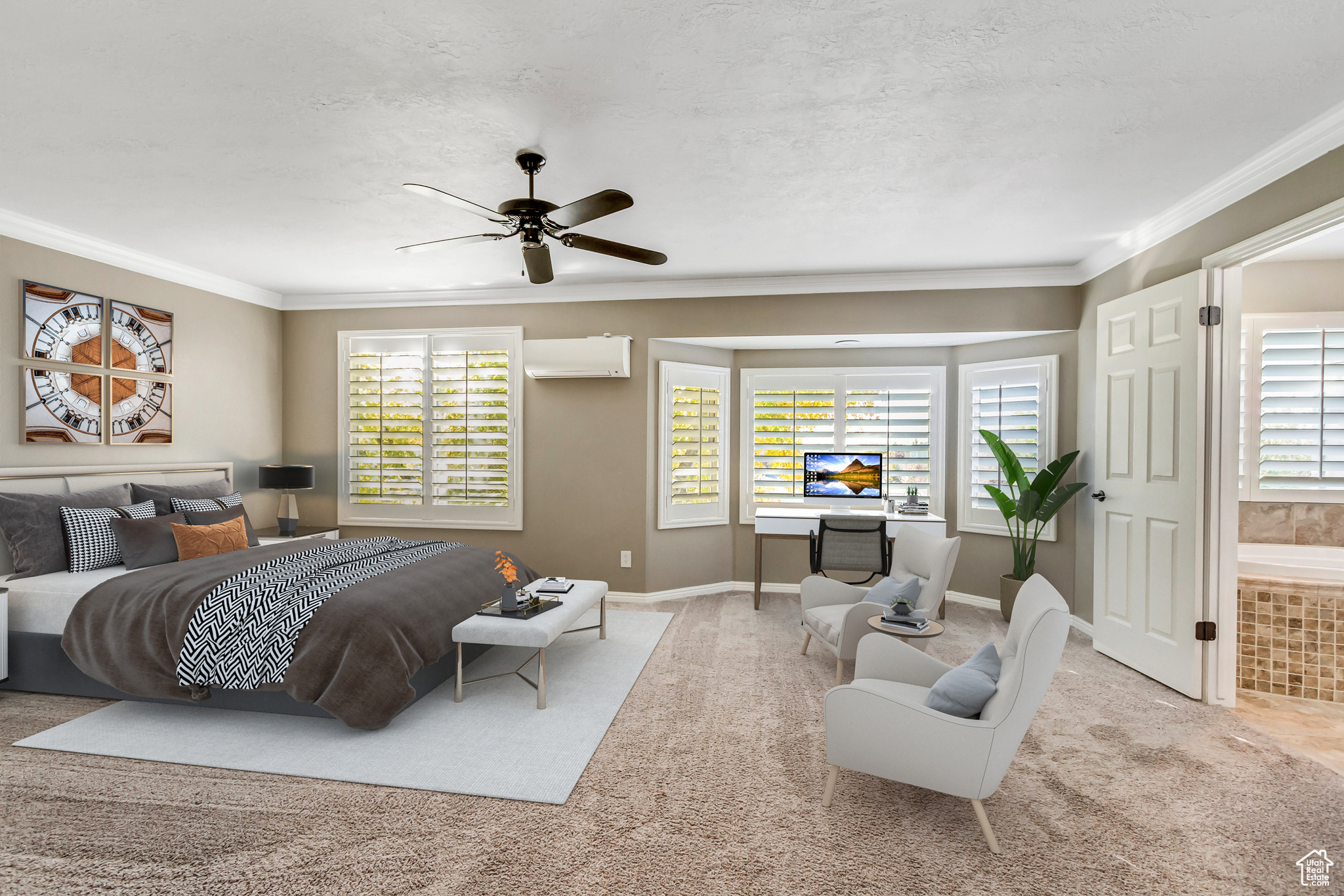 Carpeted bedroom with a wall unit AC, connected bathroom, ceiling fan, and ornamental molding