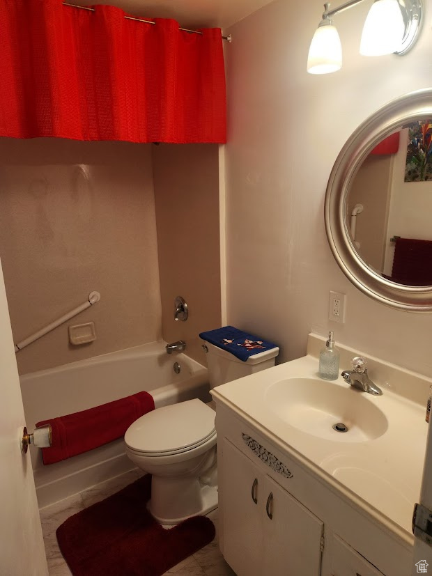 Full bathroom with  shower combination, vanity, and toilet