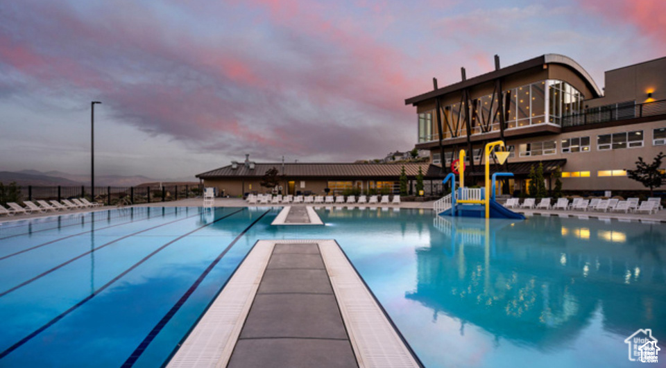 Pool at dusk with a water slide