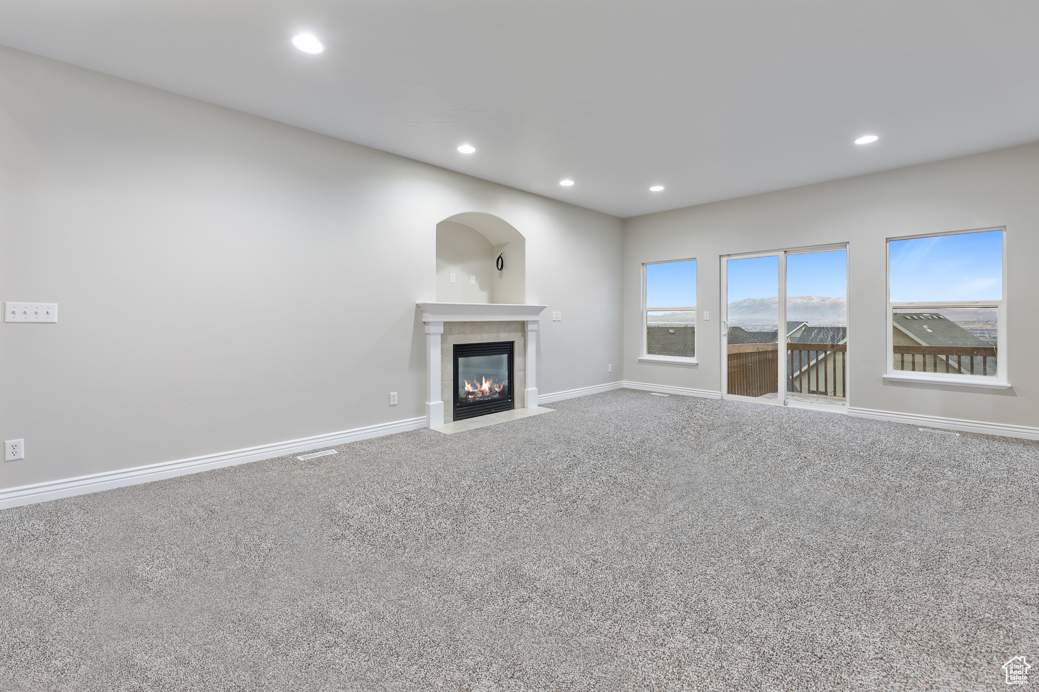 Unfurnished living room with carpet floors