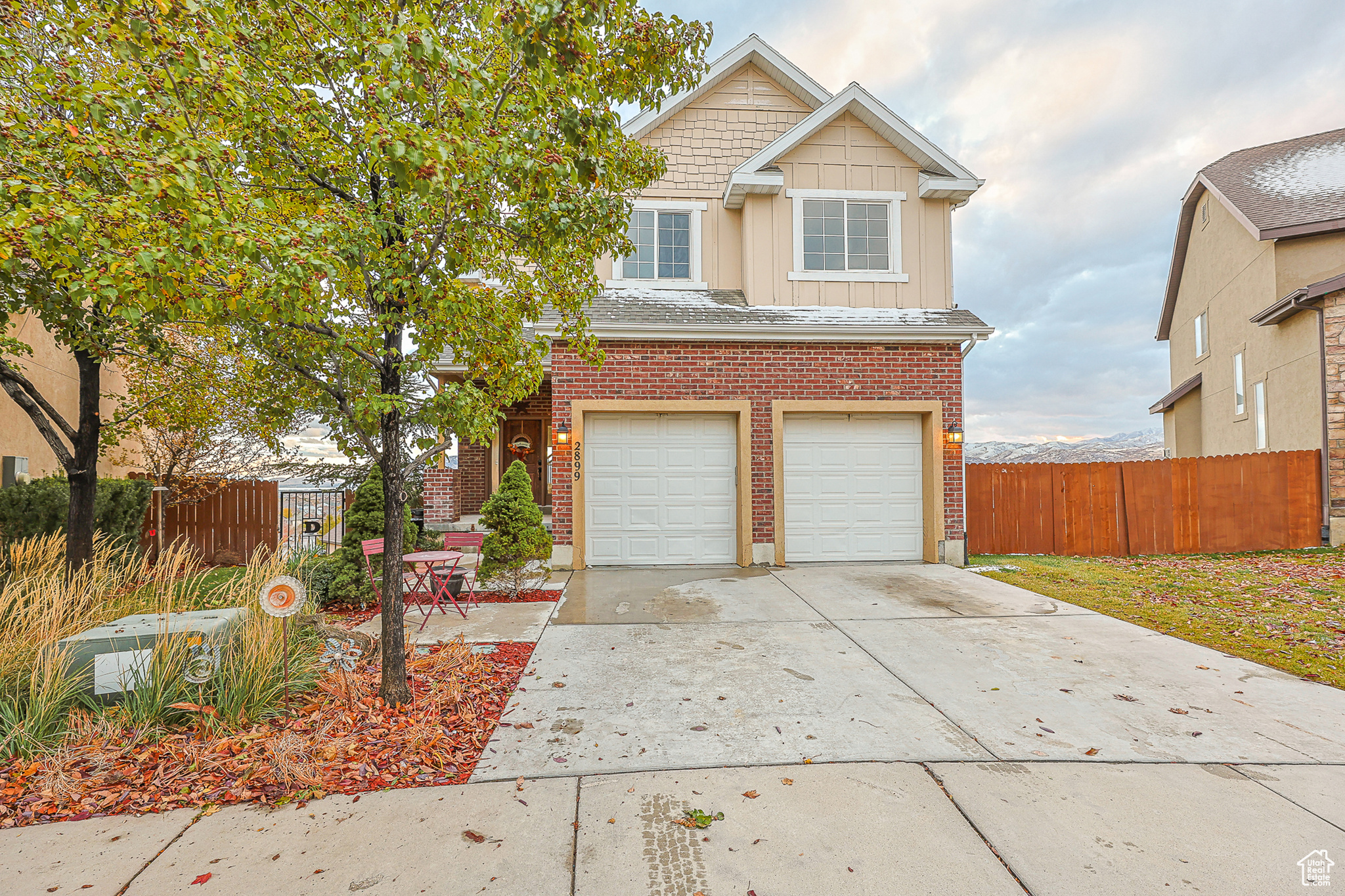 View of front facade featuring a garage