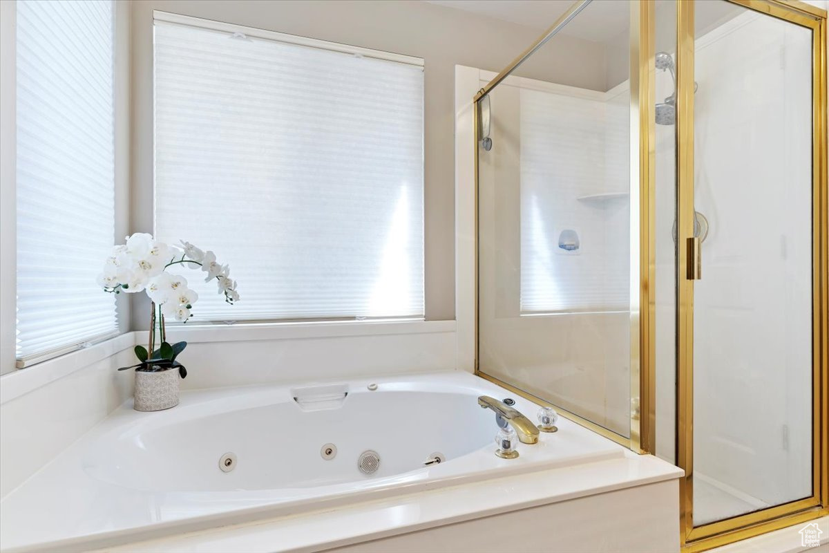 Bathroom featuring separate shower and tub