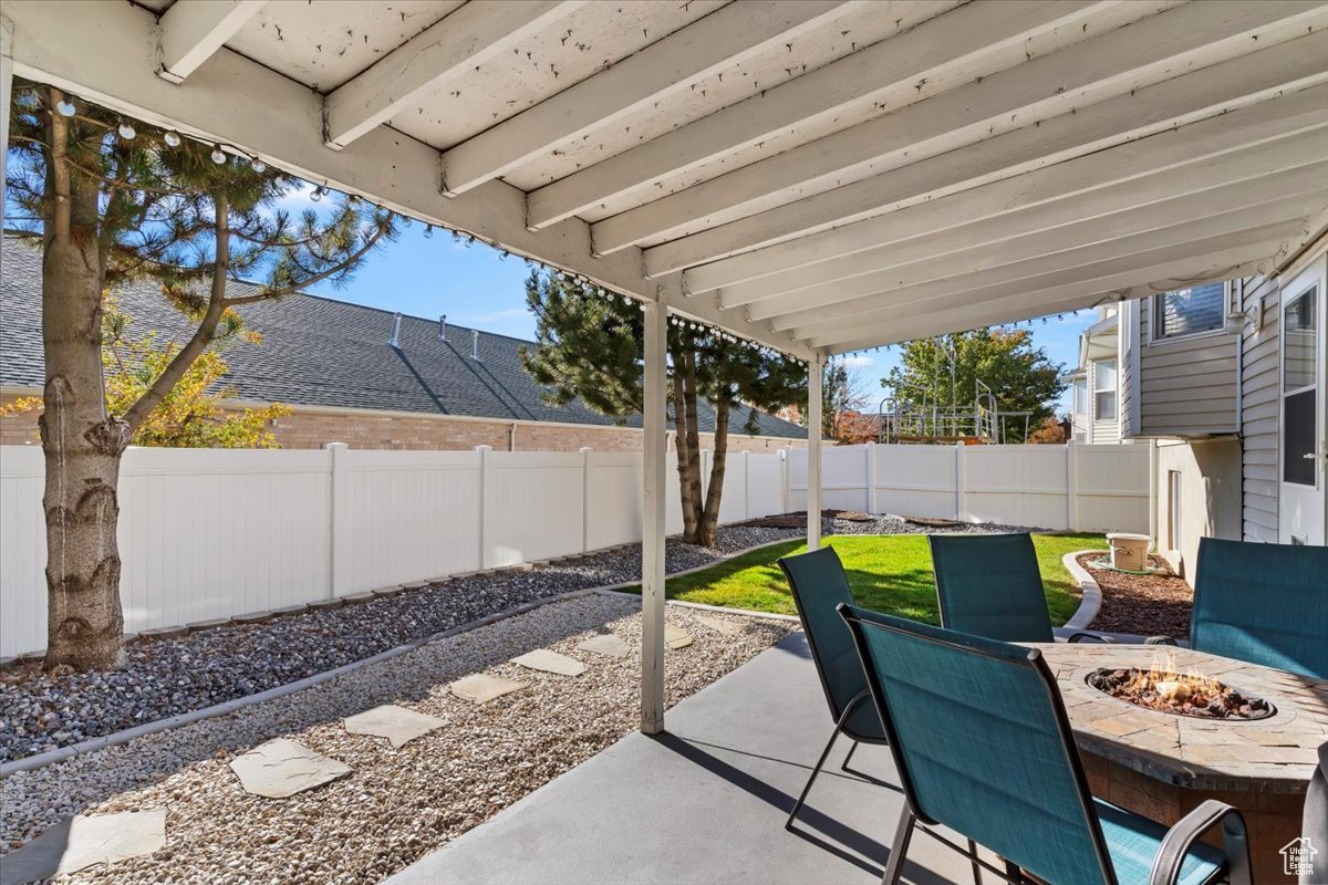 View of patio / terrace with a fire pit