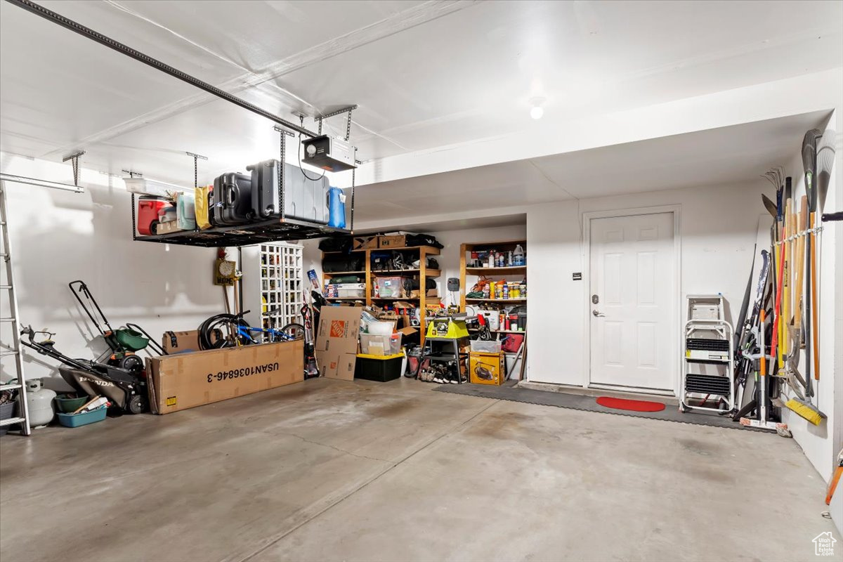 Garage featuring a garage door opener