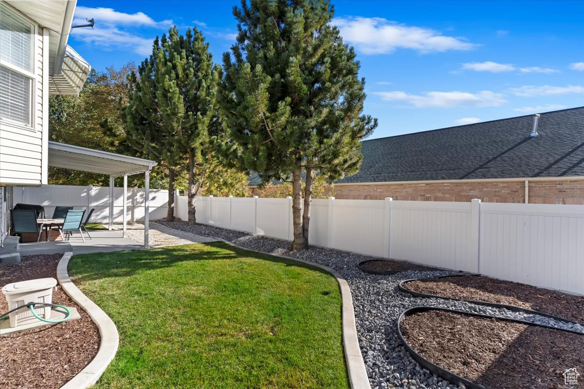 View of yard with a patio