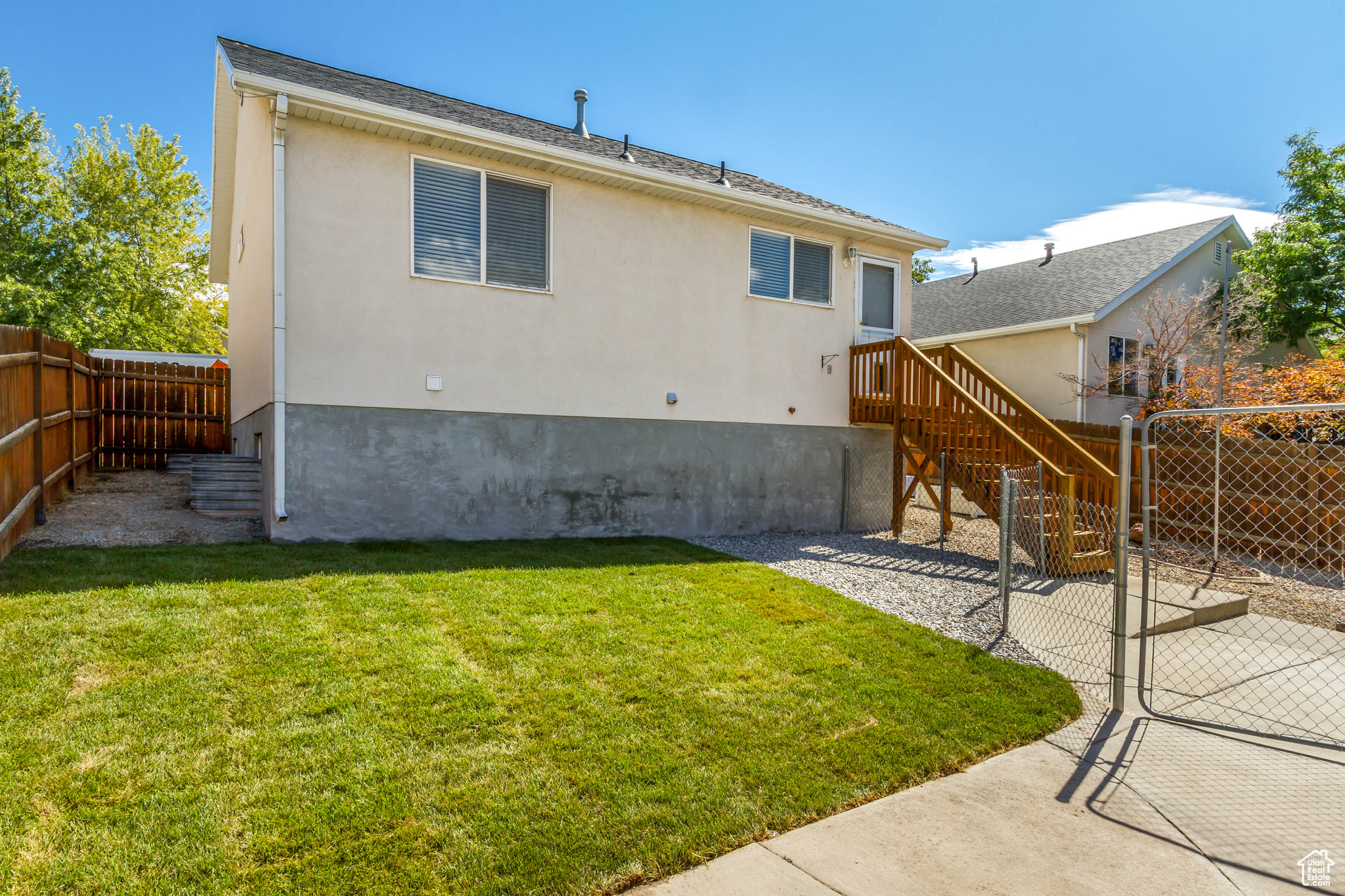 Back of property featuring a lawn