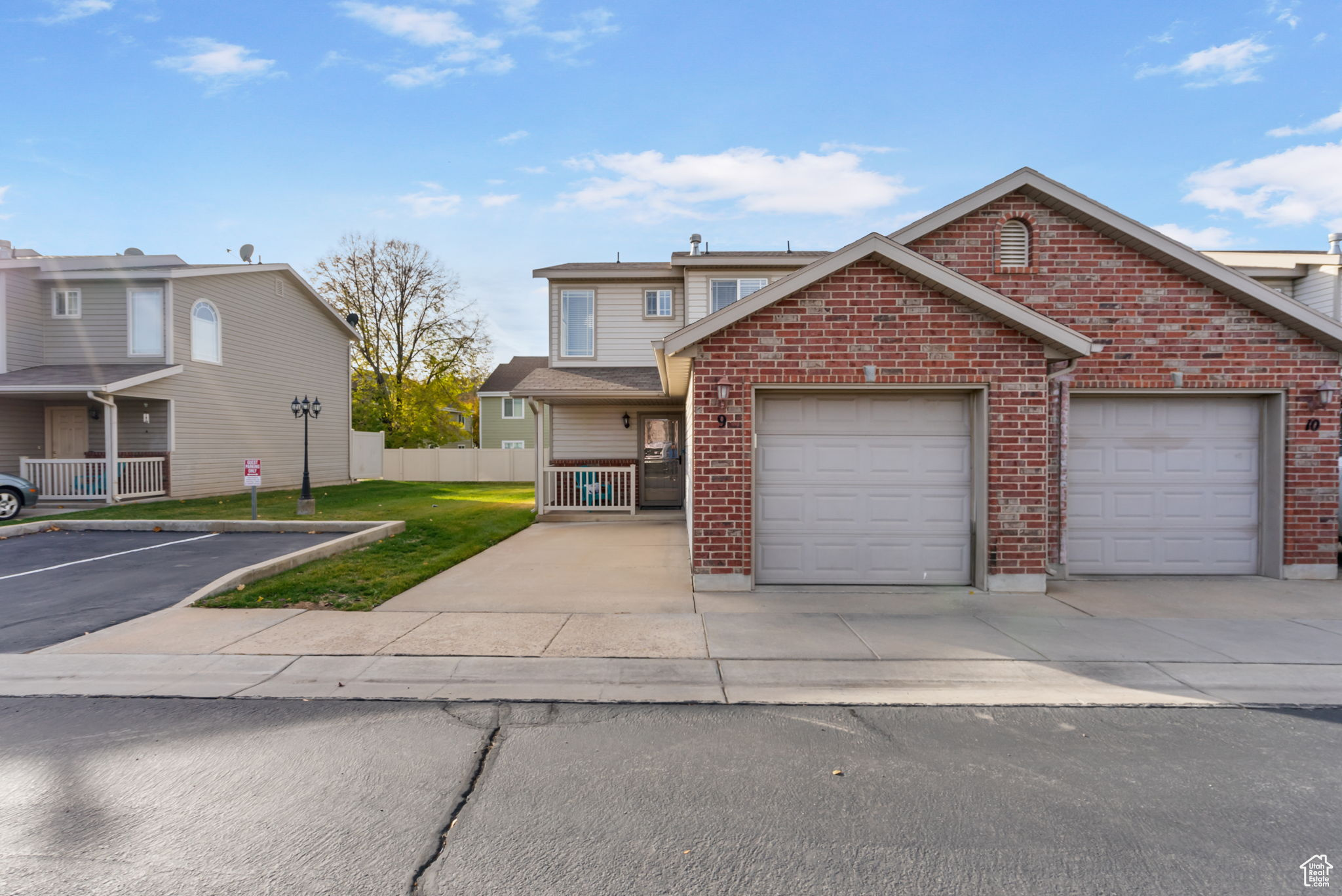 Front facade with a front lawn and a garage