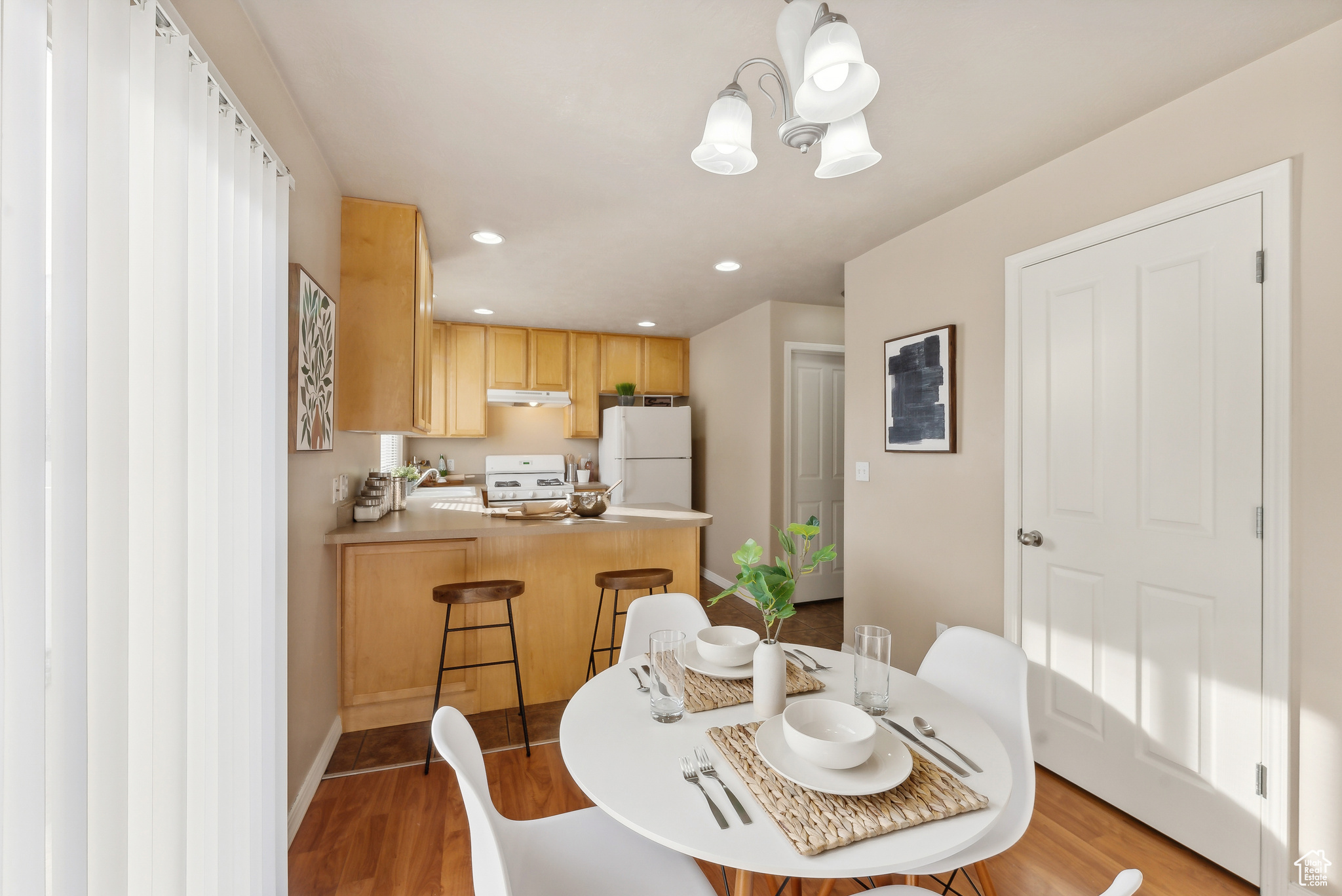 Dining room featuring light hardwood / wood-style flooring and a chandelier