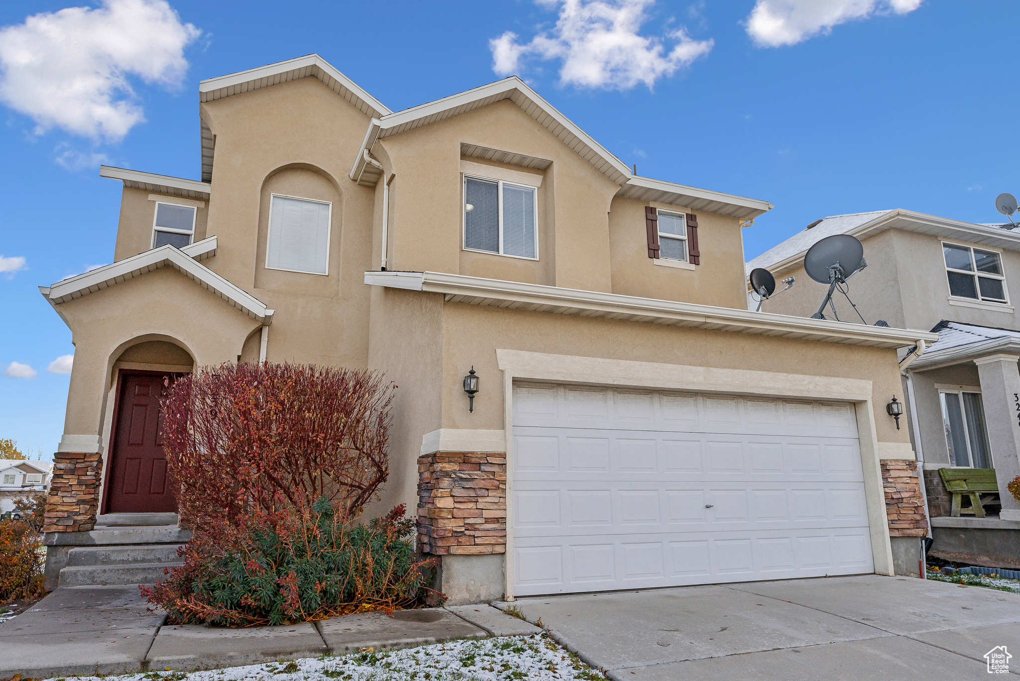 View of front of property featuring a garage