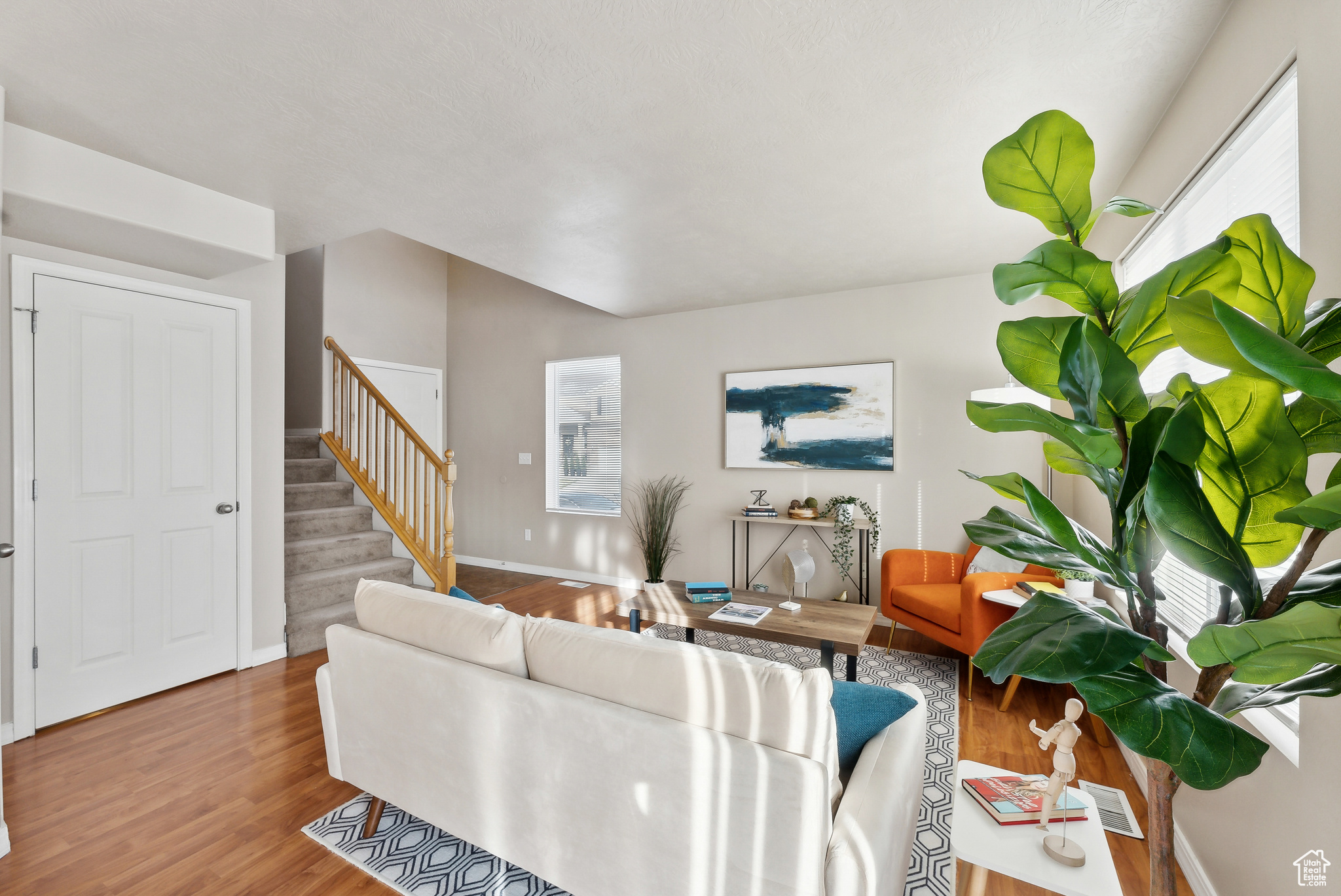 Living room with hardwood / wood-style floors