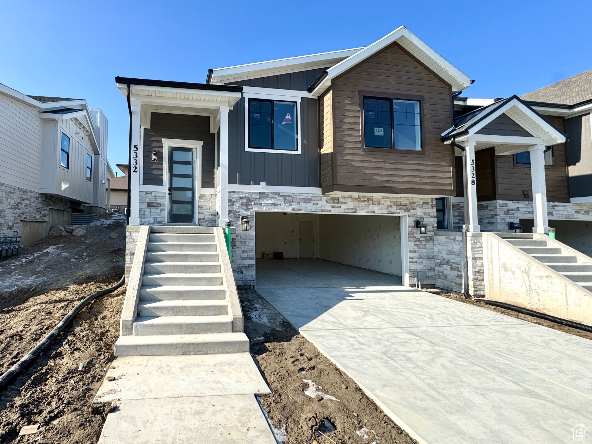 View of front facade featuring a garage