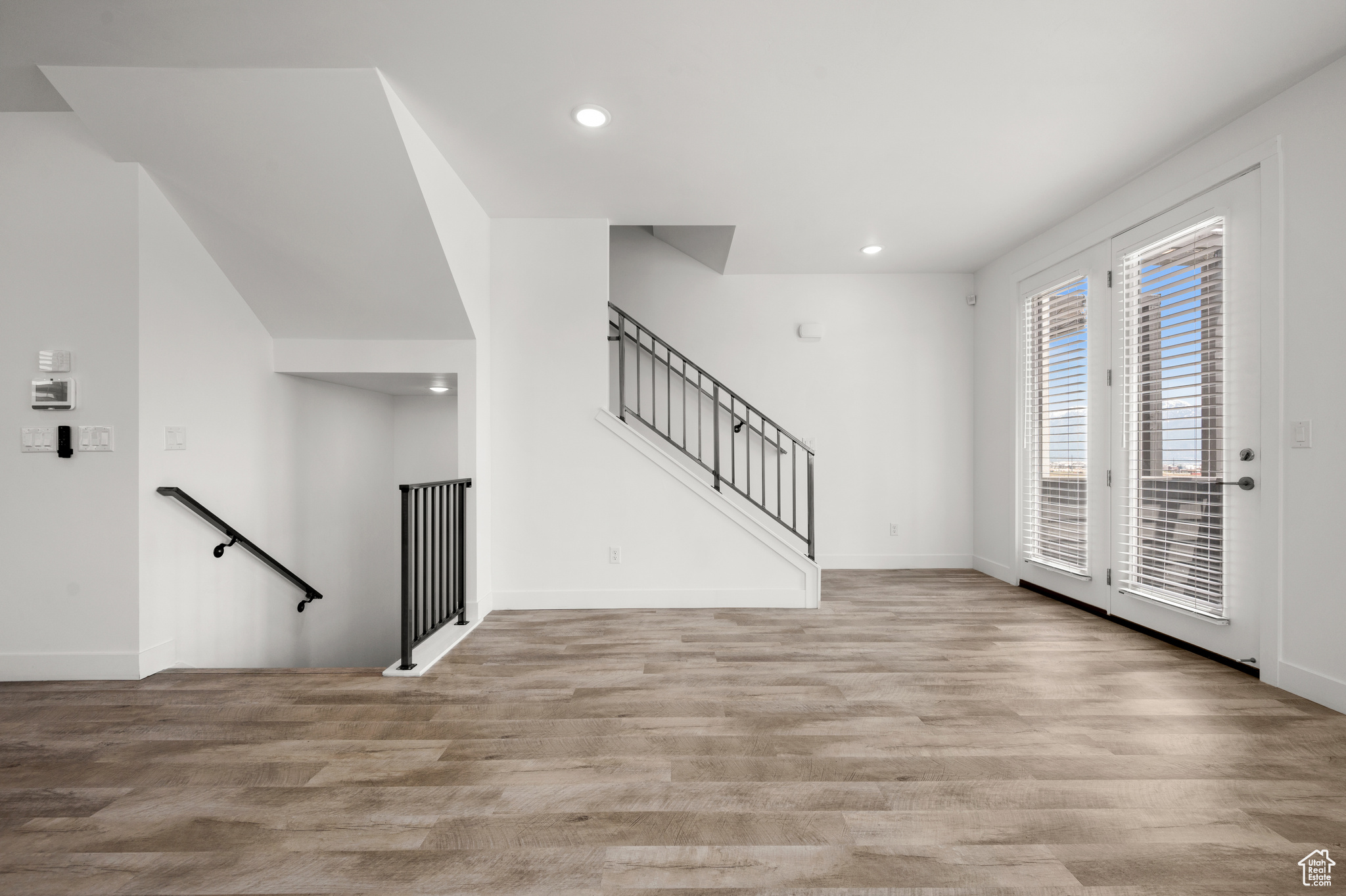 Foyer entrance with light hardwood / wood-style flooring