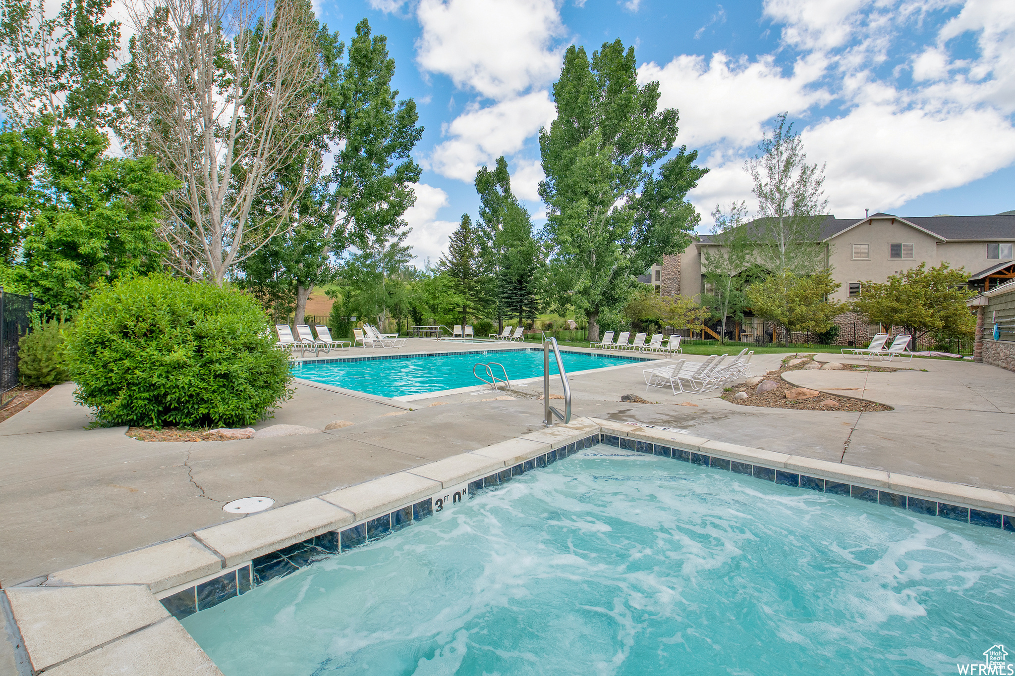 View of swimming pool with a patio