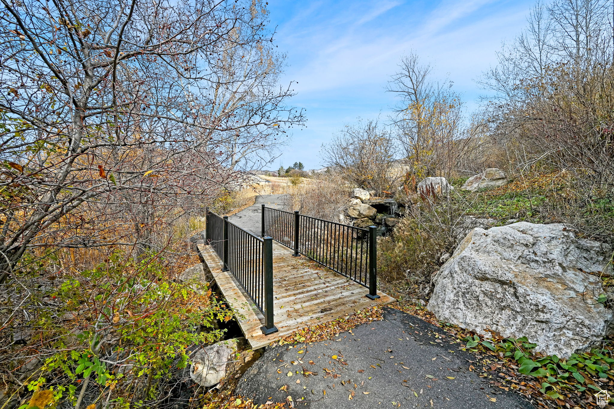 Bridge and walking path by year-round stream in behind the building