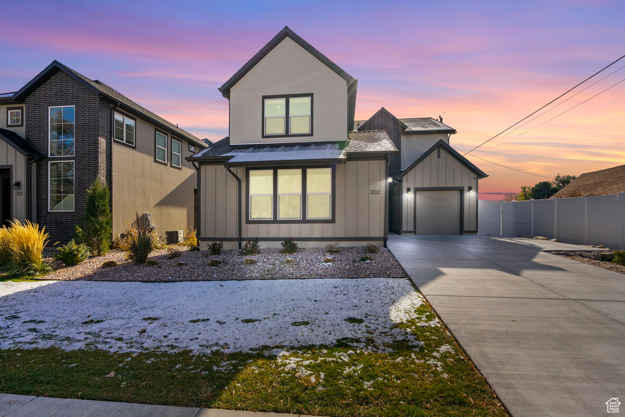 View of front facade featuring a garage