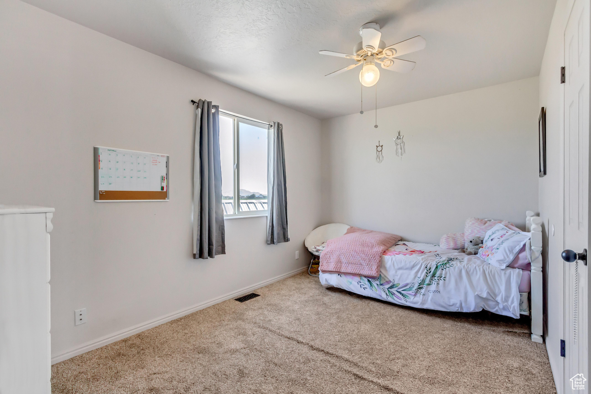 Bedroom featuring carpet flooring and ceiling fan