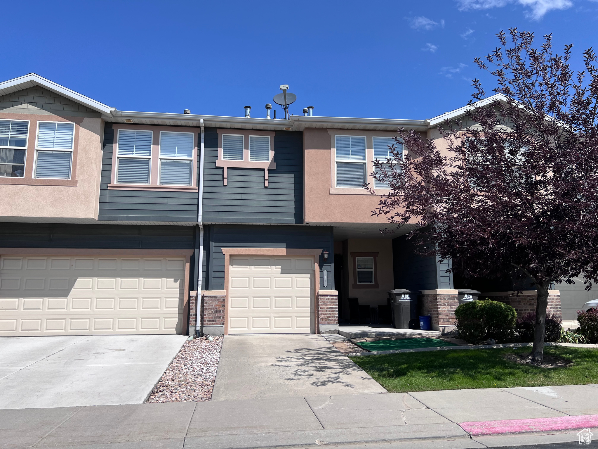 Townhome / multi-family property featuring a garage