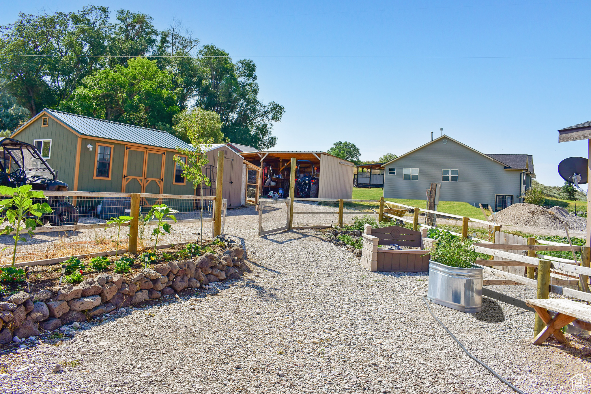 Rear view of property featuring an outdoor structure