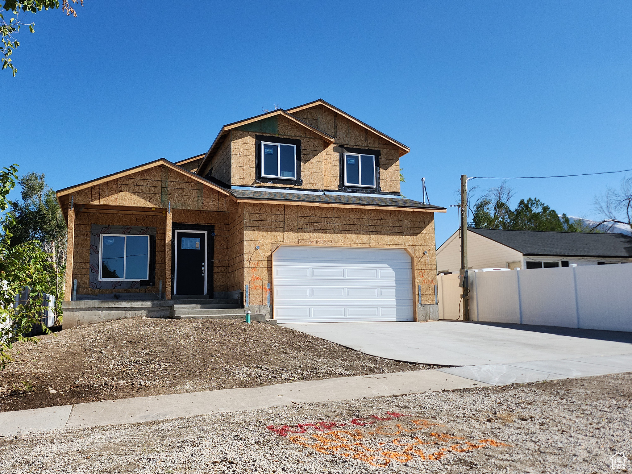 View of front of property with a garage