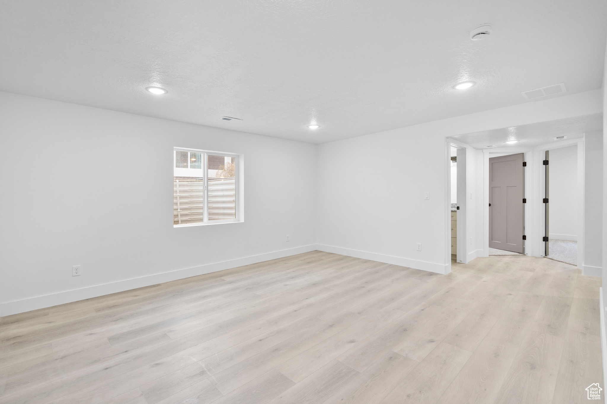 Unfurnished room featuring light hardwood / wood-style floors