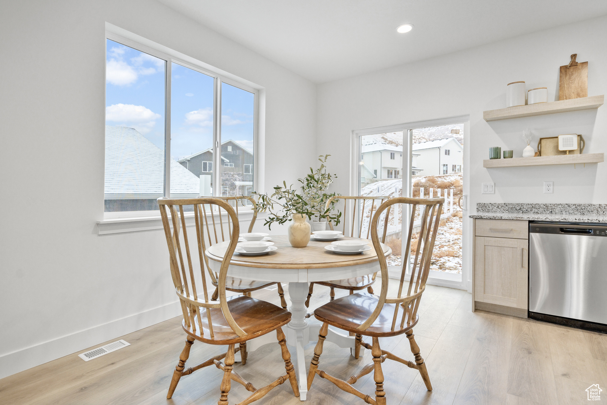 Dining area with a healthy amount of sunlight and light wood-type flooring