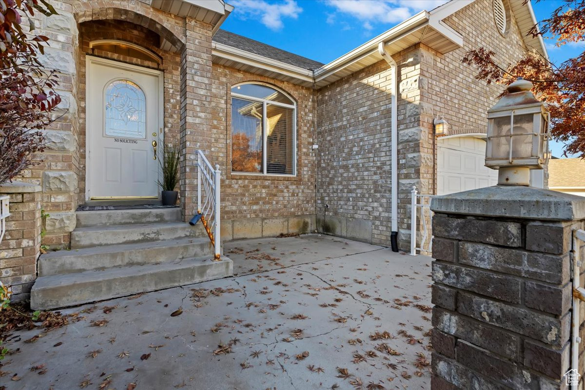 Property entrance with a garage