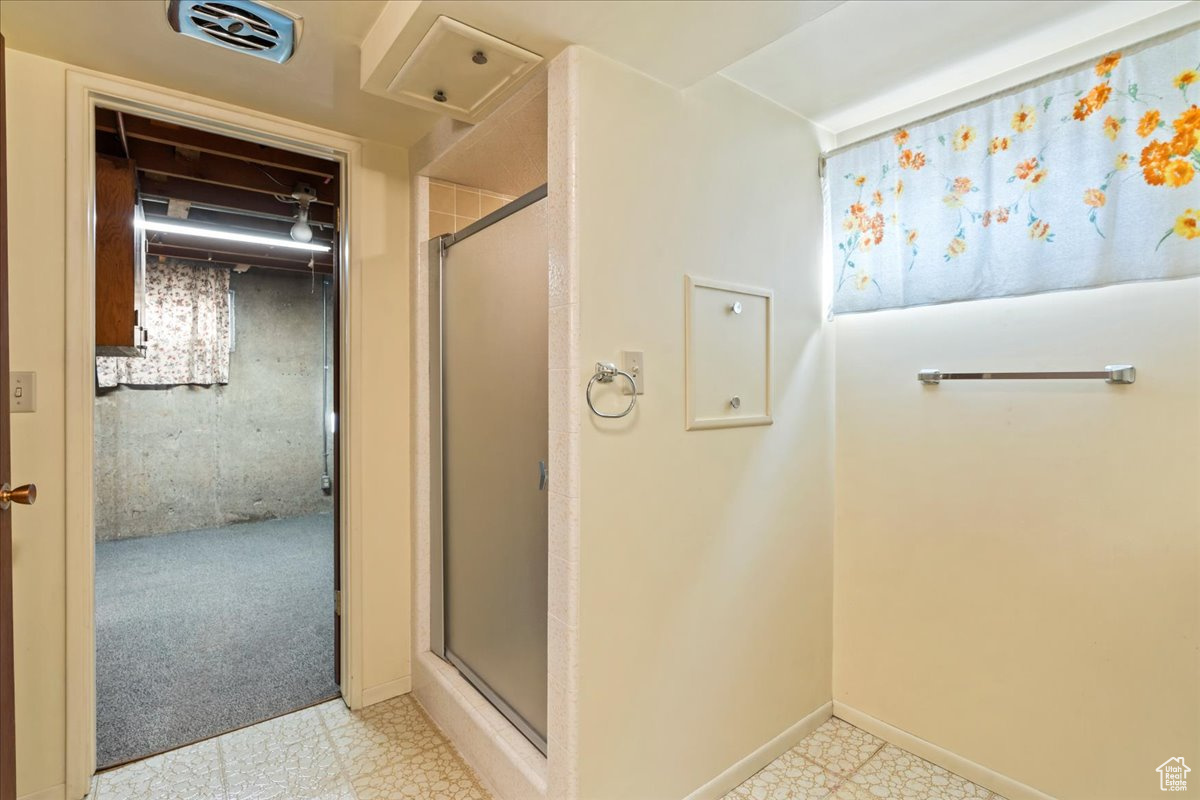 Bathroom featuring an enclosed shower