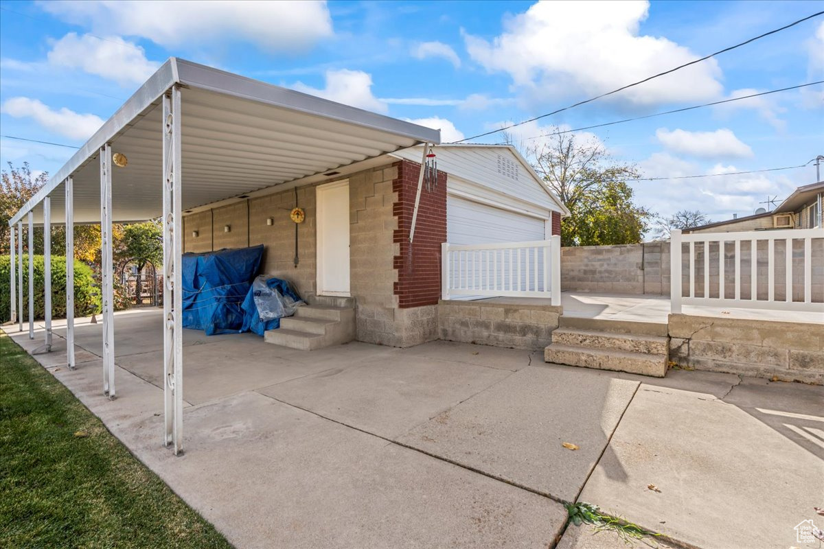 View of side of property with a garage