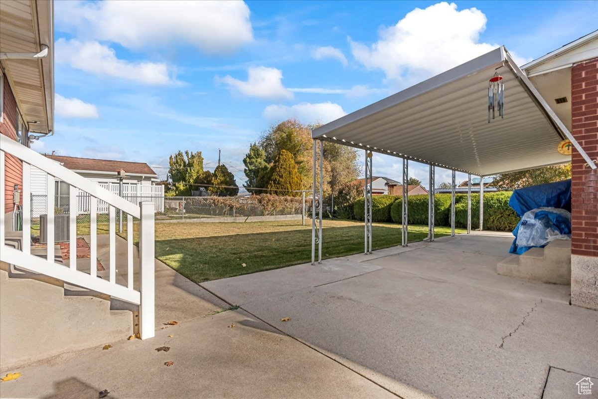 View of patio featuring a carport