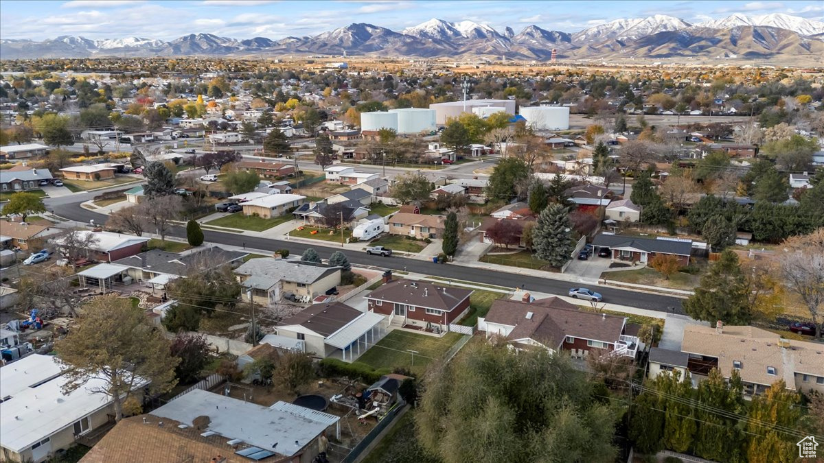 Birds eye view of property with a mountain view