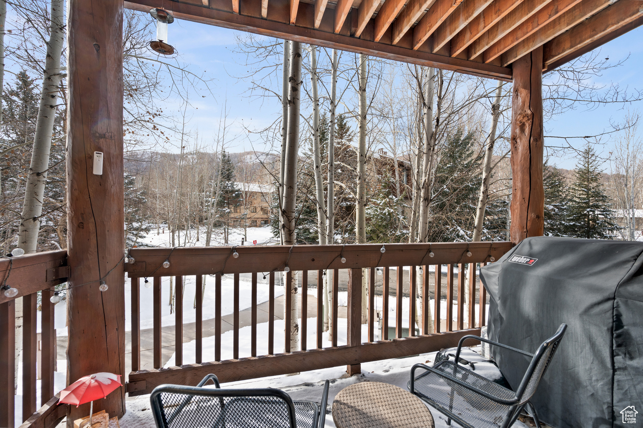 Snow covered deck featuring grilling area