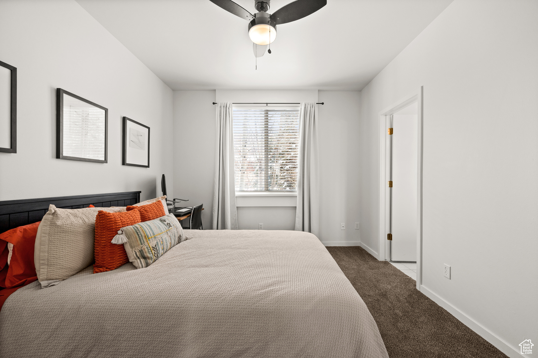 Bedroom with carpet flooring and ceiling fan