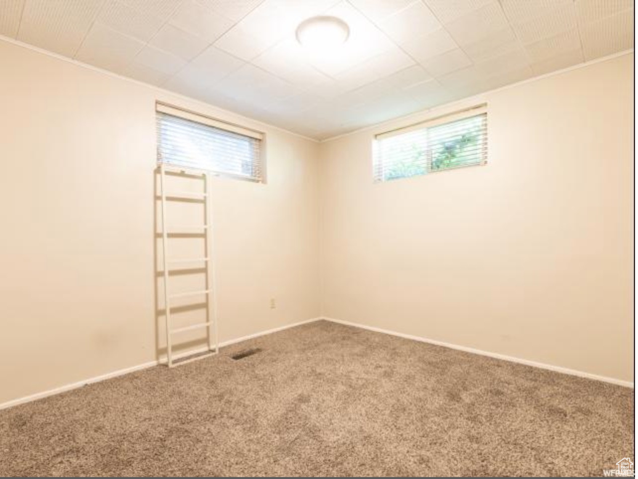 Spare room featuring carpet