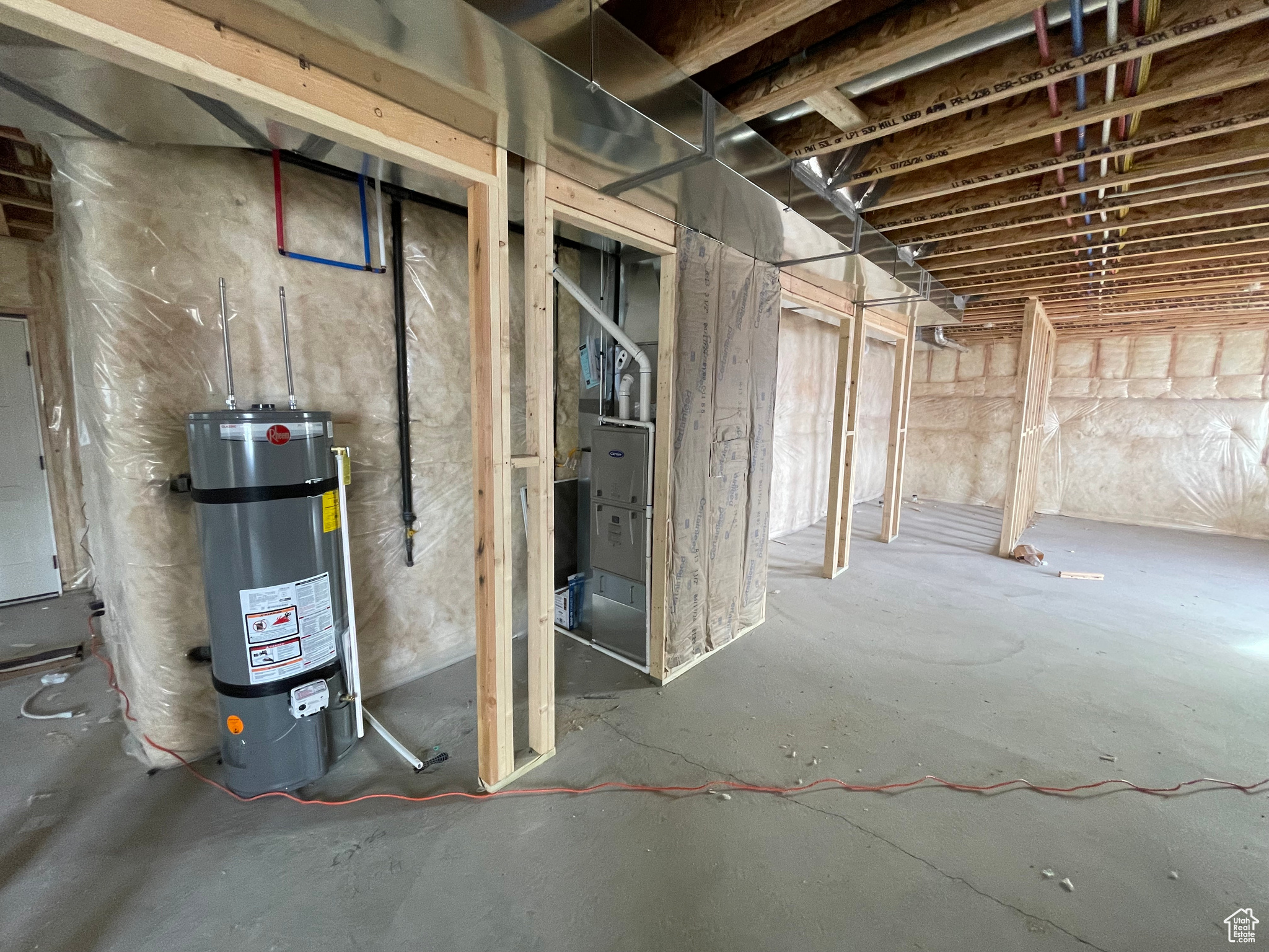 Basement featuring secured water heater