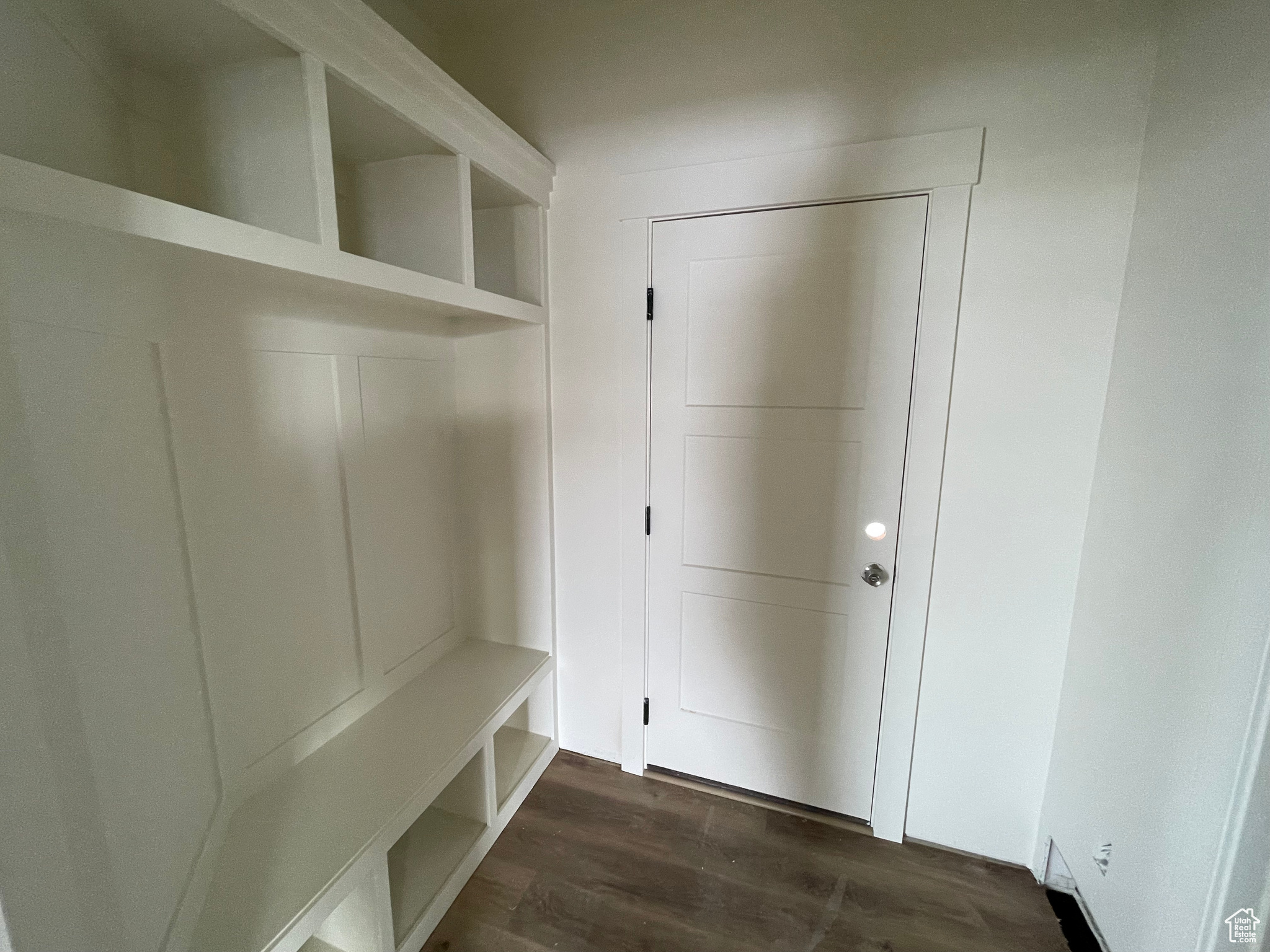 Mudroom with dark hardwood / wood-style floors