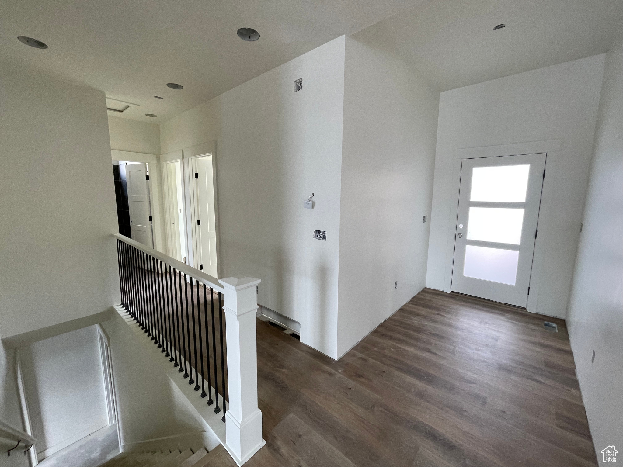 Foyer with dark wood-type flooring