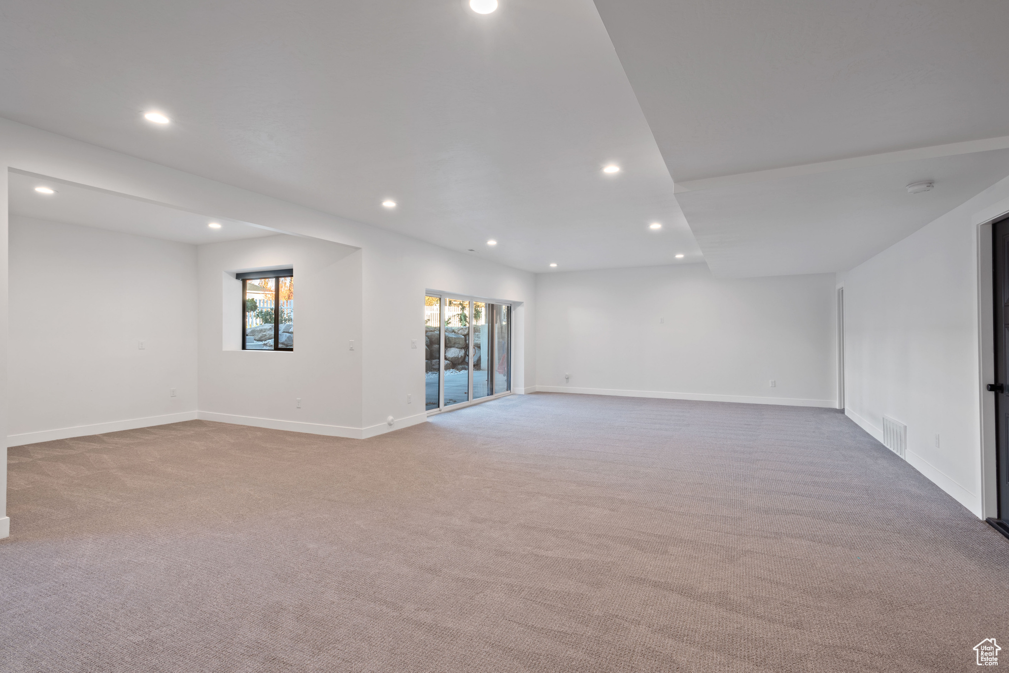 Empty room featuring carpet flooring