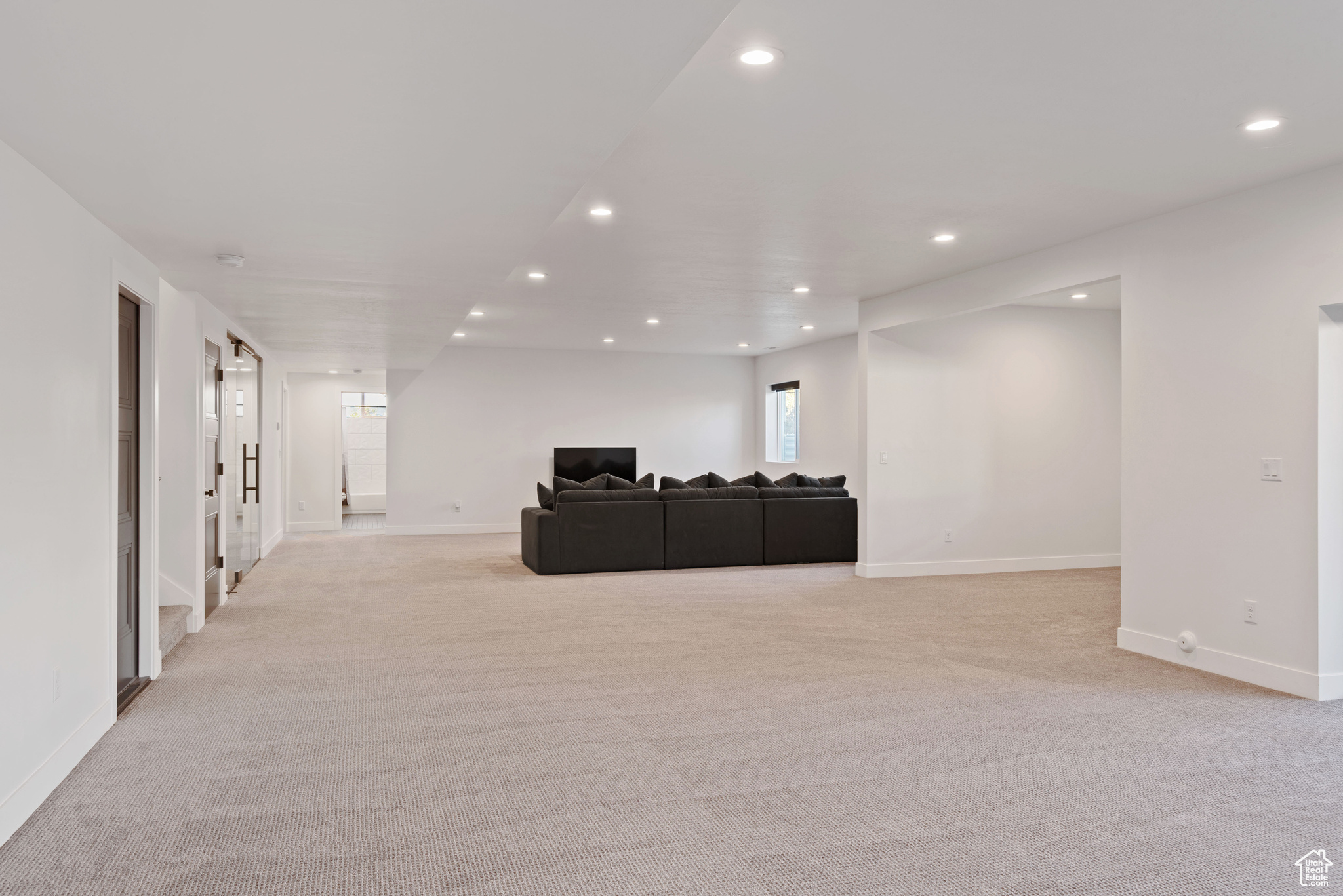 Living room featuring light carpet